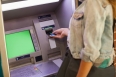 Student withdrawing cash at an ATM