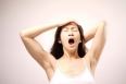 Asian chinese lady yawning after waking up
