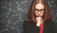 girl student, the teacher writes on  blackboard chalk formula