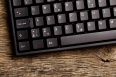 computer keyboard on old wooden table