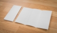 Trifold white template paper on wood texture