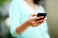 Closeup portrait of a woman using smartphone