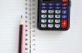 pen, calculator and notebook